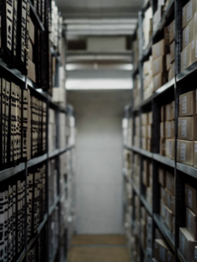 Archive shelves with labelled archive boxes, vanishing perspective