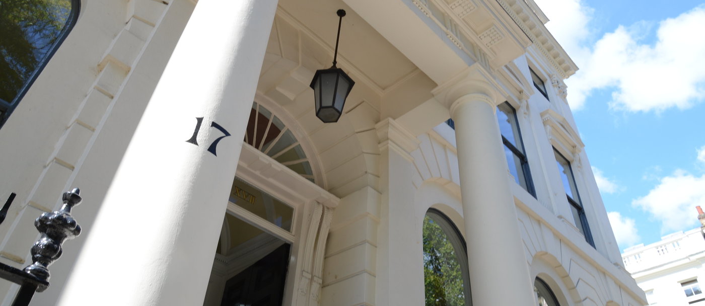 Front entrance of the GHIL Image of the front entrance of the GHIL, taken from a low angle and showing the building from the left of the portico to the upper right corner of the building, highlighting the number 17 on the left-hand pillar of the portico